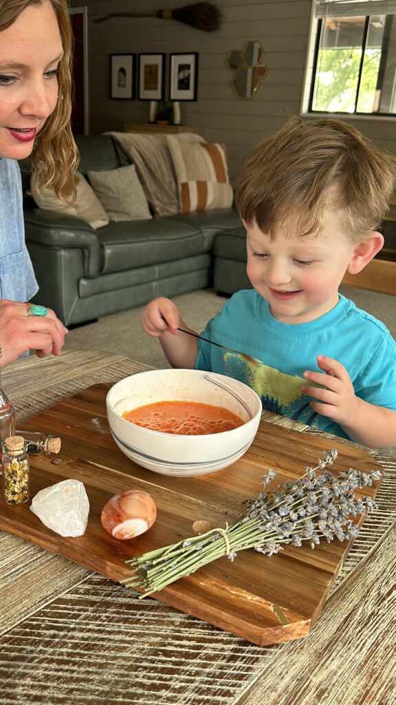 woman helping child with potion kit