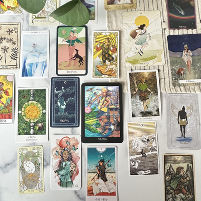 the fool tarot card in various decks laid out